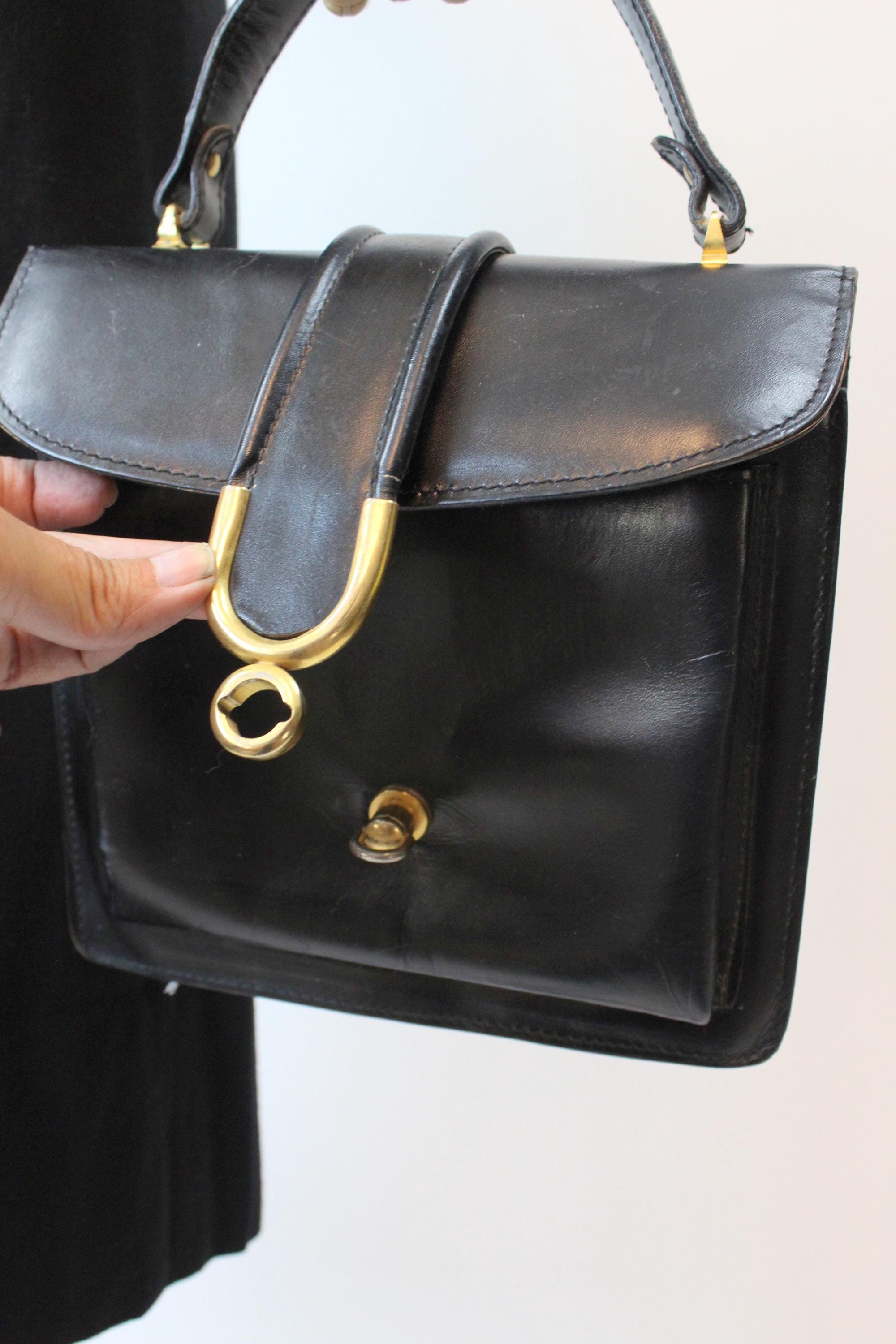 Vintage calf skin leather bag with gold colored hardware. factory Circa 1950.